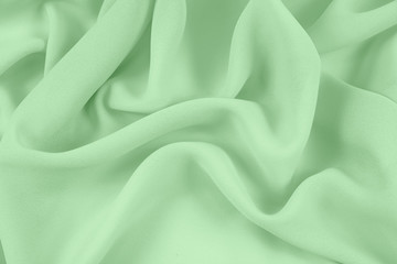 Texture chiffon fabric light green color for backgrounds  