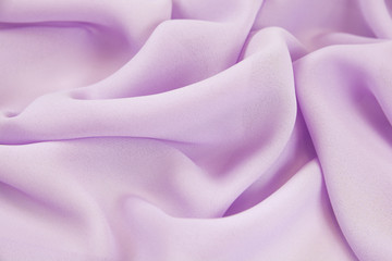 Fototapeta na wymiar Texture chiffon fabric lilac color for backgrounds 