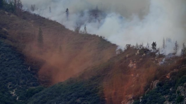 Epic Large Air Tanker Aircraft Drops Retardant on Forest Fire
