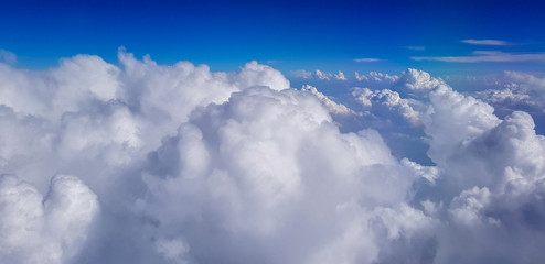 Cumulonimbus cloud above sky view from airplane - obrazy, fototapety, plakaty