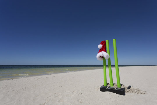 Cricket Wickets And A Santa Hat On The Beach, An Aussie Christmas