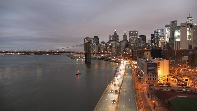 Wide view of traffic on FDR Drive in New York at dusk.