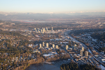 Aerial view of Residential Neighborhood during a vibrant sunset. Taken in Port Moody, Greater Vancouver, British Columbia, Canada.