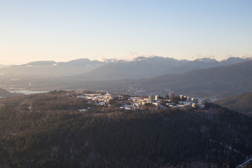 Aerial view of Burnaby Mountain during a vibrant sunset. Taken in Greater Vancouver, British Columbia, Canada.