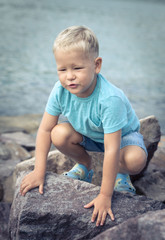 Cute caucasian boy at seaside