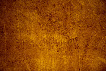 gold brown background paper with vintage grunge background texture with black scuffed edges and old...