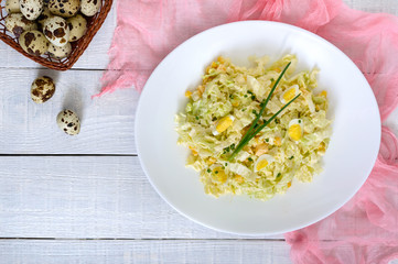 Light spring dietary salad from Chinese cabbage, cheese, quail eggs, corn. Proper nutrition. Top view.