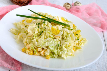 Light spring dietary salad from Chinese cabbage, cheese, quail eggs, corn. Proper nutrition.