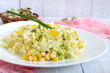 Light spring dietary salad from Chinese cabbage, cheese, quail eggs, corn. Proper nutrition.