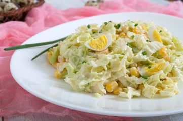 Light spring dietary salad from Chinese cabbage, cheese, quail eggs, corn. Proper nutrition.