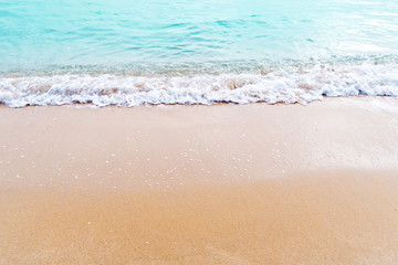Fototapeta na wymiar Soft waves on the beach
