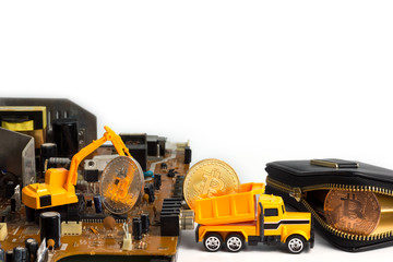 Obraz premium Backhoe dig bitcoin on mainboard put in the truck and transport it to the leather wallet. Concept of bitcoin mining business.