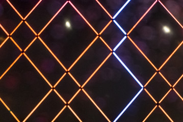 Abstract color neon or led lights background with bokeh effect