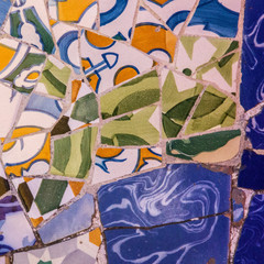 Ceramic tile background, tile vintage pattern. Broken glass mosaic decoration in Park Guell, Barcelona, Spain. Designed by Gaudi