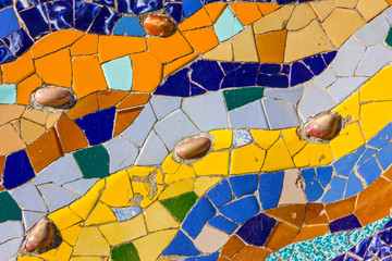 Obraz premium Ceramic tile vintage pattern. Broken glass mosaic tile, decoration in Park Guell, Barcelona, Spain. Designed by Gaudi