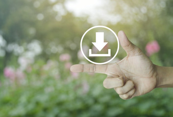 Download icon on finger over blur pink flower and tree, Business internet concept