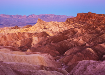 View of Manly Beacon  and Red Cathedral from Zabriskie Point at dawn,  Amargosa Range, Death Valley in Death Valley National Park in California, United States.