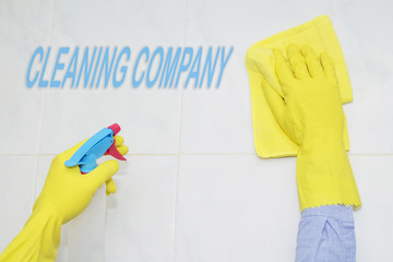 cleaning tiles with cleaning products and disinfectants. cleaning company concept