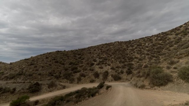 driving on off road tracks in the puntas de calnegre natural park on the coast in murcia, spain