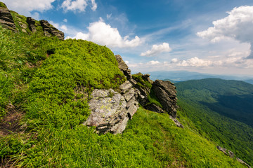 beautiful summer landscape in mountains. view from the hillside in to the valley and nearby ridge under the cloudy sky