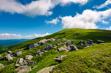 huge rocky formation on the grassy hillside. beautiful landscape of Runa mountain on a bright summer day