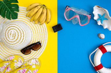 Top view of beach summer accessories with copy space. Traveler accessories. Summer background. Summer beach vacation concept. Flat lay, top view.