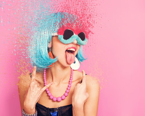 Pop girl portrait wearing weird sunglasses and blue wig, dispersion effect