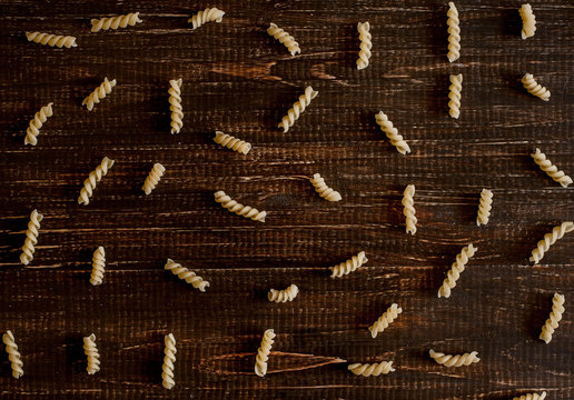 Variety of kinds and forms of dry macaroni. Italian macaroni raw food or texture: pasta, spaghetti, pasta in the form of a spiral. - Powered by Adobe