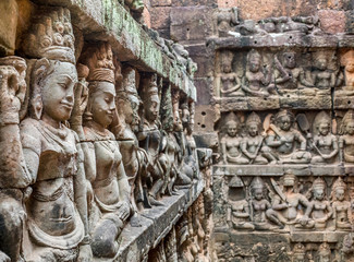 Women sculptures at Angkor temple.