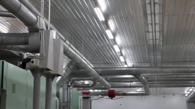 pipe system and production equipment in the factory. the camera is in motion
