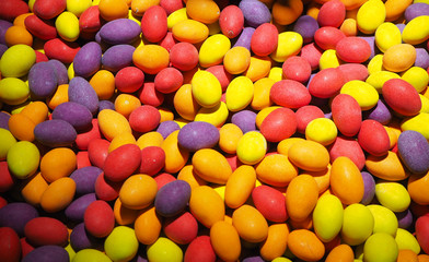 Fototapeta na wymiar Close up of bowls filled with a large selection of different colored soft candies