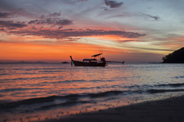Boat on ocean sunrise 