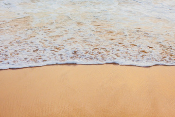 Wave foam on the beach