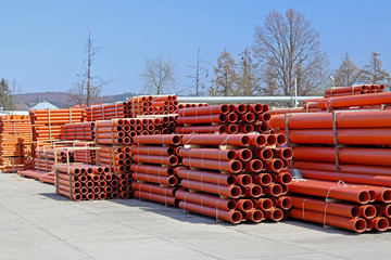 The warehouse of industrial plastic pipes and large diameter hoses. Products from plastic. Drainage...