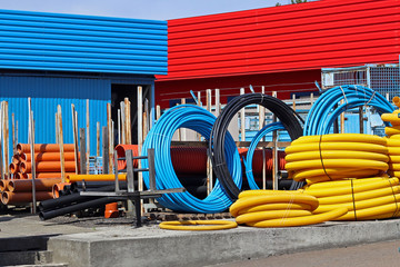 The warehouse of industrial plastic pipes and large diameter hoses. Products from plastic. Drainage...