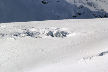 Winter landscape with snow covered peaks of Caucasus mountains, view from Elbrus mountain, Russia