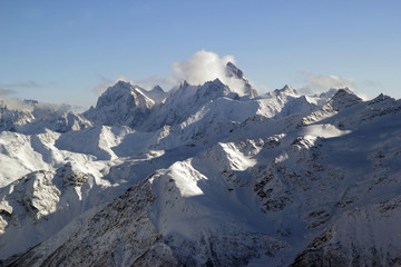 Winter landscape with snow covered peaks of Caucasus mountains, view from Elbrus mountain, Russia
