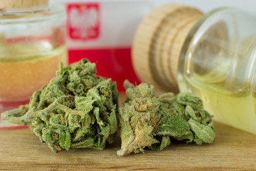 Medical Oil Cannabis - marijuana flowers on the wooden stopper with cannabis oil  bottles.