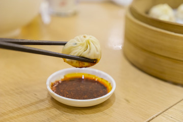 Delicious dumpling with sauce