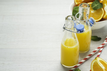 orange juice, oranges, white background, space for text.