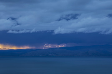 Naklejka na ściany i meble Lightning above the lake Titicaca, Bolivia