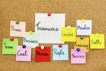 Teamwork Concept with Sticky Notes on a Cork Board