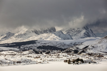 Obraz premium Beautiful landscape with clouds and mountains in background at Lofoten Island, Norway