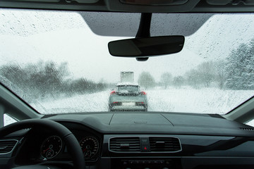 Heavy traffic in winter time, view from on board of car.