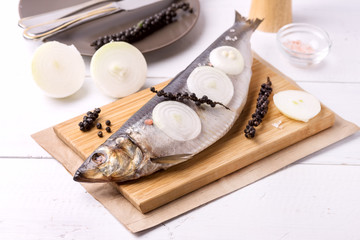 Delicious Salted Herring with Onion and Pepper on the Wooden Desk White Wooden Background Rustic Style Fresh and Tasty Fish