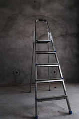 ladder of a stepladder in a gray room