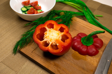 Cutting red pepper. Vegetarian salad cooking. Healthy food.