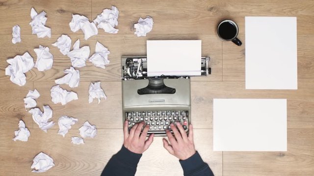 Book author's frustration, angry writer on a vintage typewriter. 4k video black and white and colors