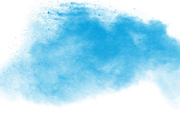 Abstract blue dust explosion on white background. Blue powder splattered on  background. Freeze...