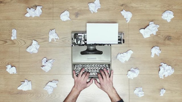 Book author's frustration, angry writer on a vintage typewriter. 4k video black and white and colors